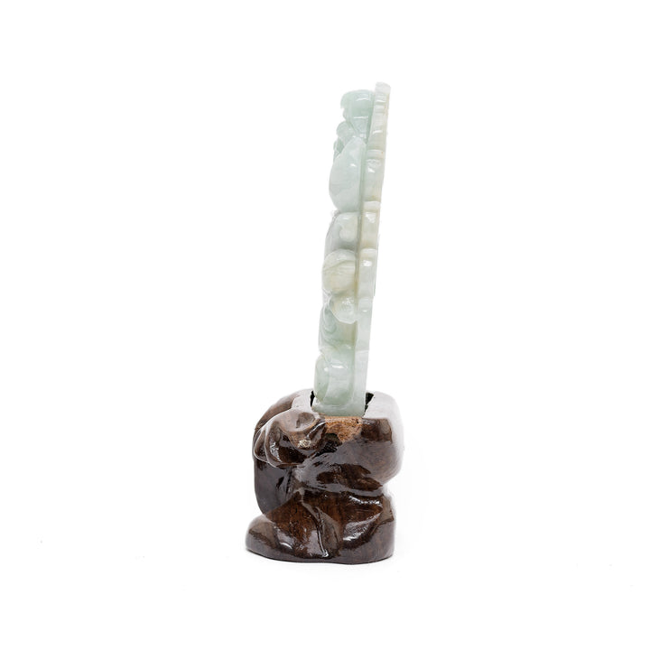 Side view of jade Guan Yin figure holding scepter