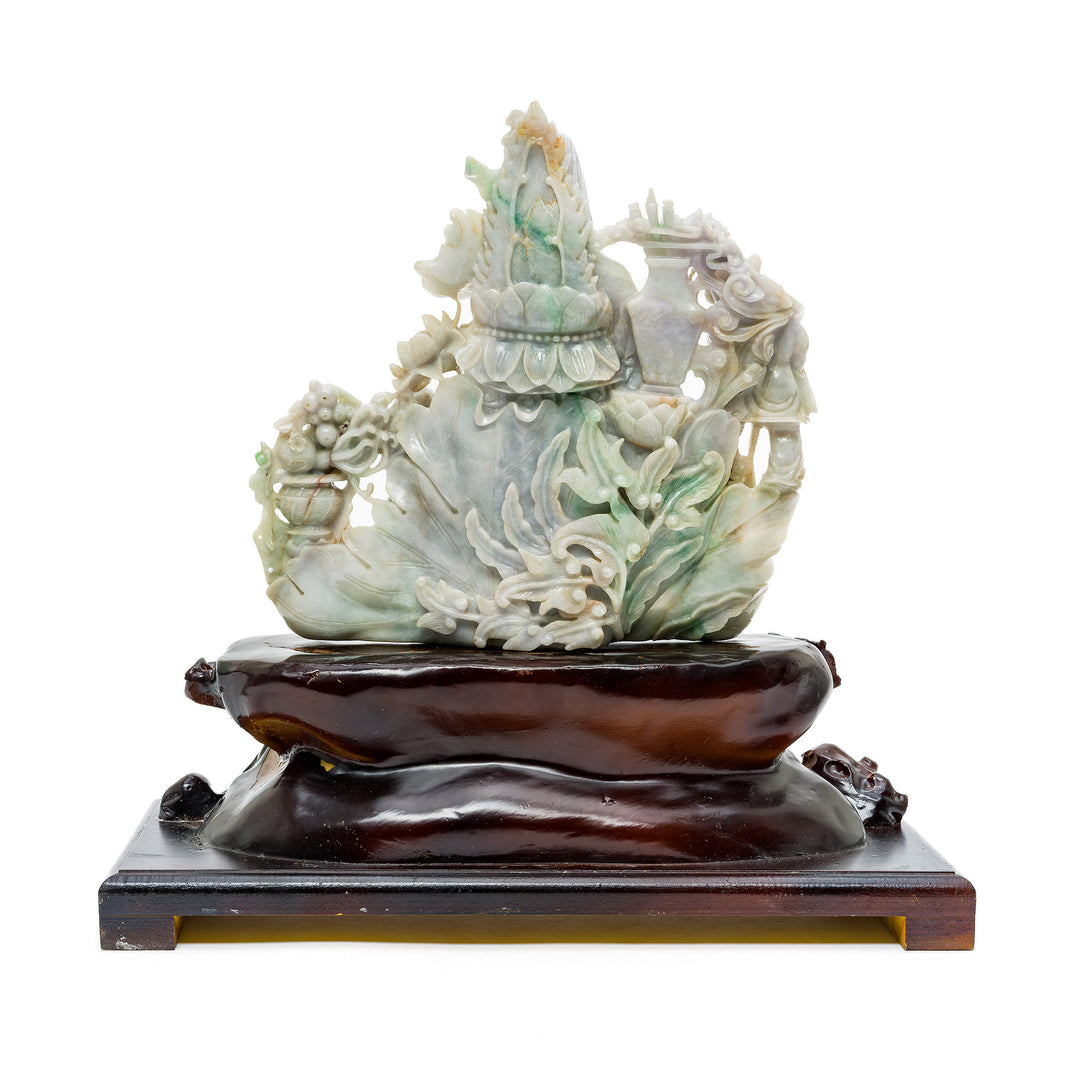Side view of Quan Yin statue with layered jade detail