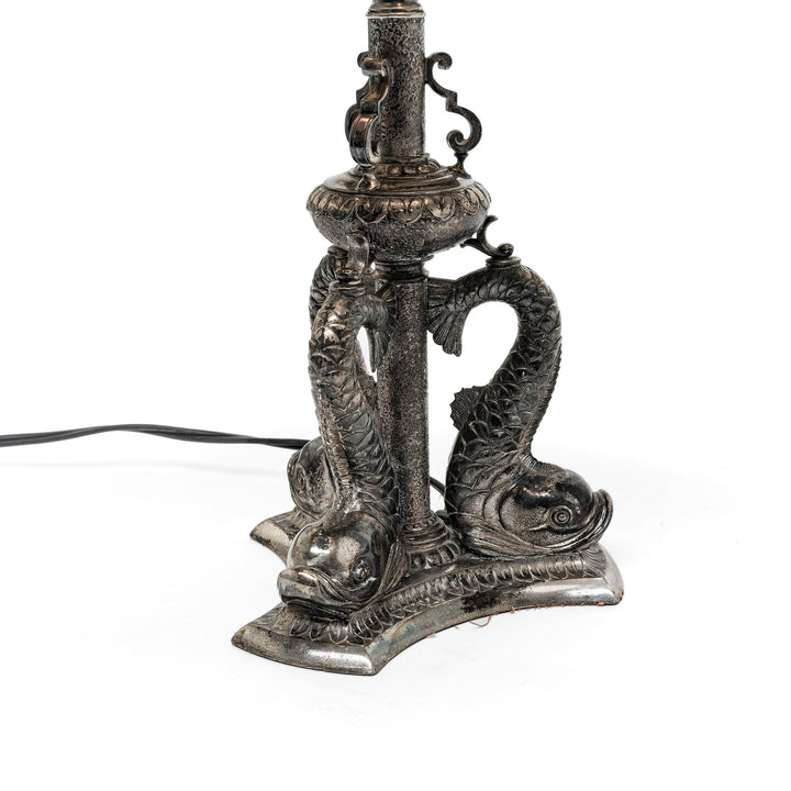 Antique silver patina on intricate dolphin motif base
