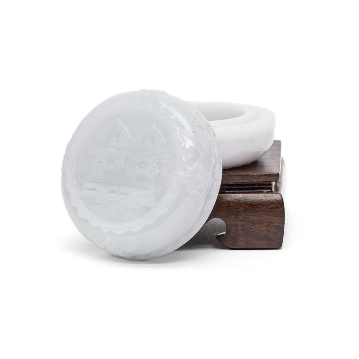 Symbolic jade jewelry holder with unity emblem