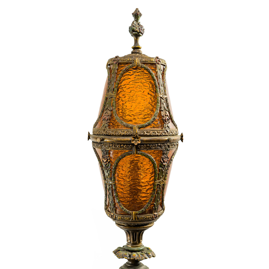 Tall Gothic Revival floor lamp with glowing amber shad