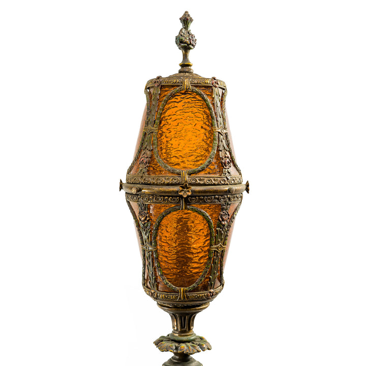 Tall Gothic Revival floor lamp with glowing amber shad