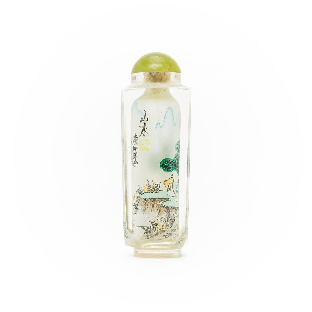 Traditional art glass snuff bottle featuring serene scenery