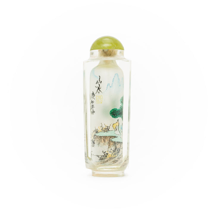 Traditional art glass snuff bottle featuring serene scenery