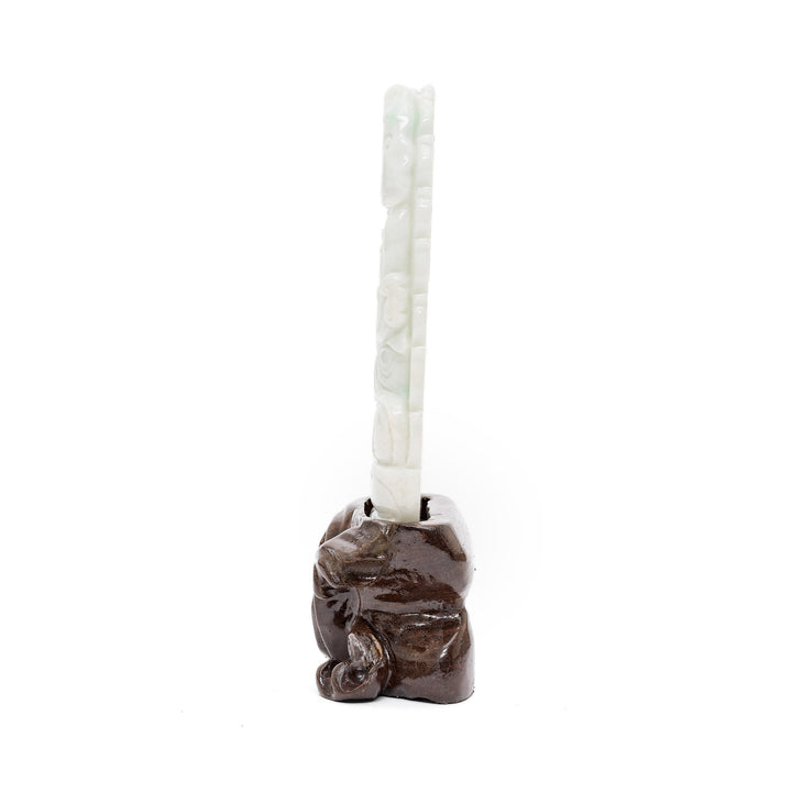 Vertical jade sculpture with divine symbolism