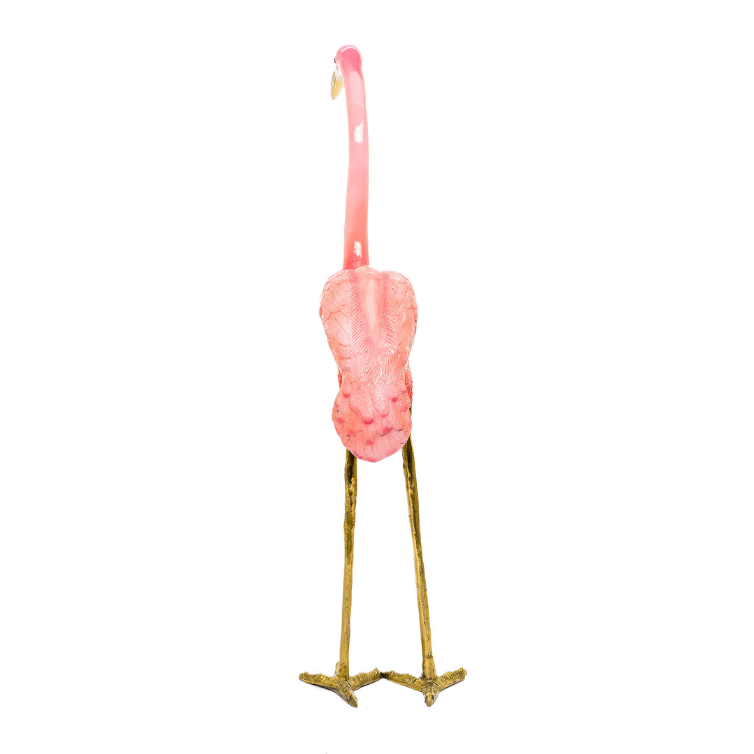 Vibrant pink flamingo statue in bronze with intricate details.