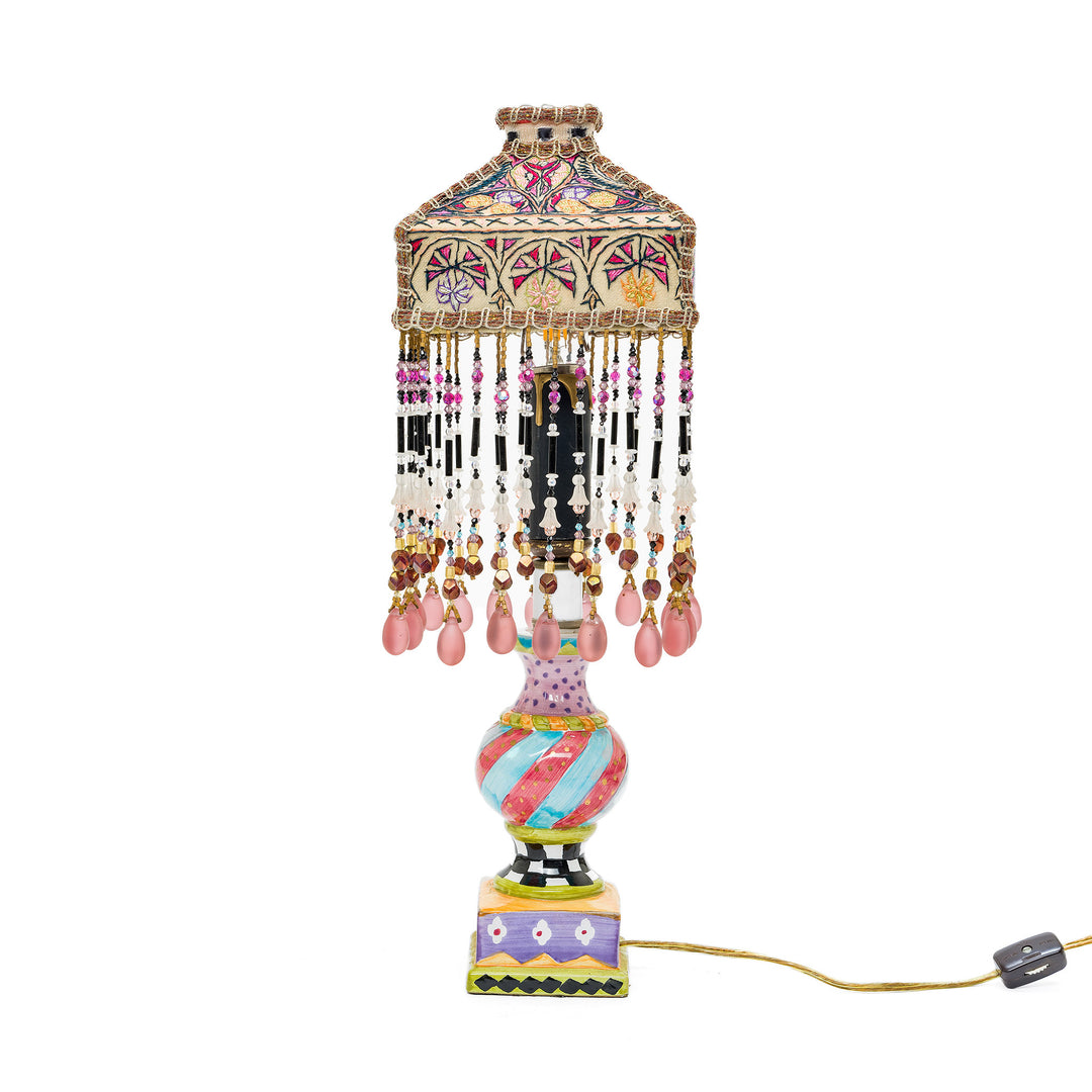 Vintage artistic table lamp with colorful patterns and intricate shad