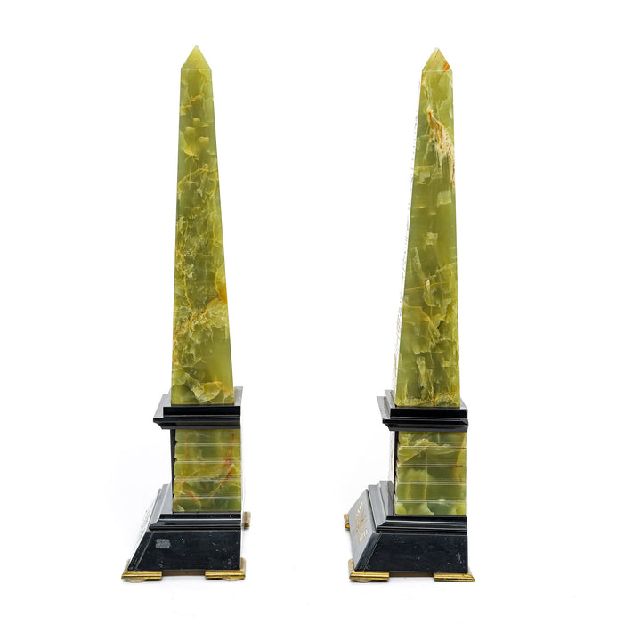 Vintage onyx obelisks with Egyptian gold engravings, black marble and bronze bases.