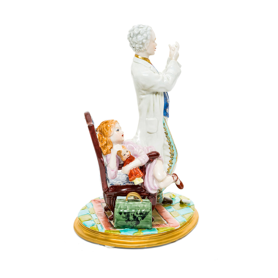 Whimsical doctor and patient figurine crafted from fine German porcelain with hand-painted features.