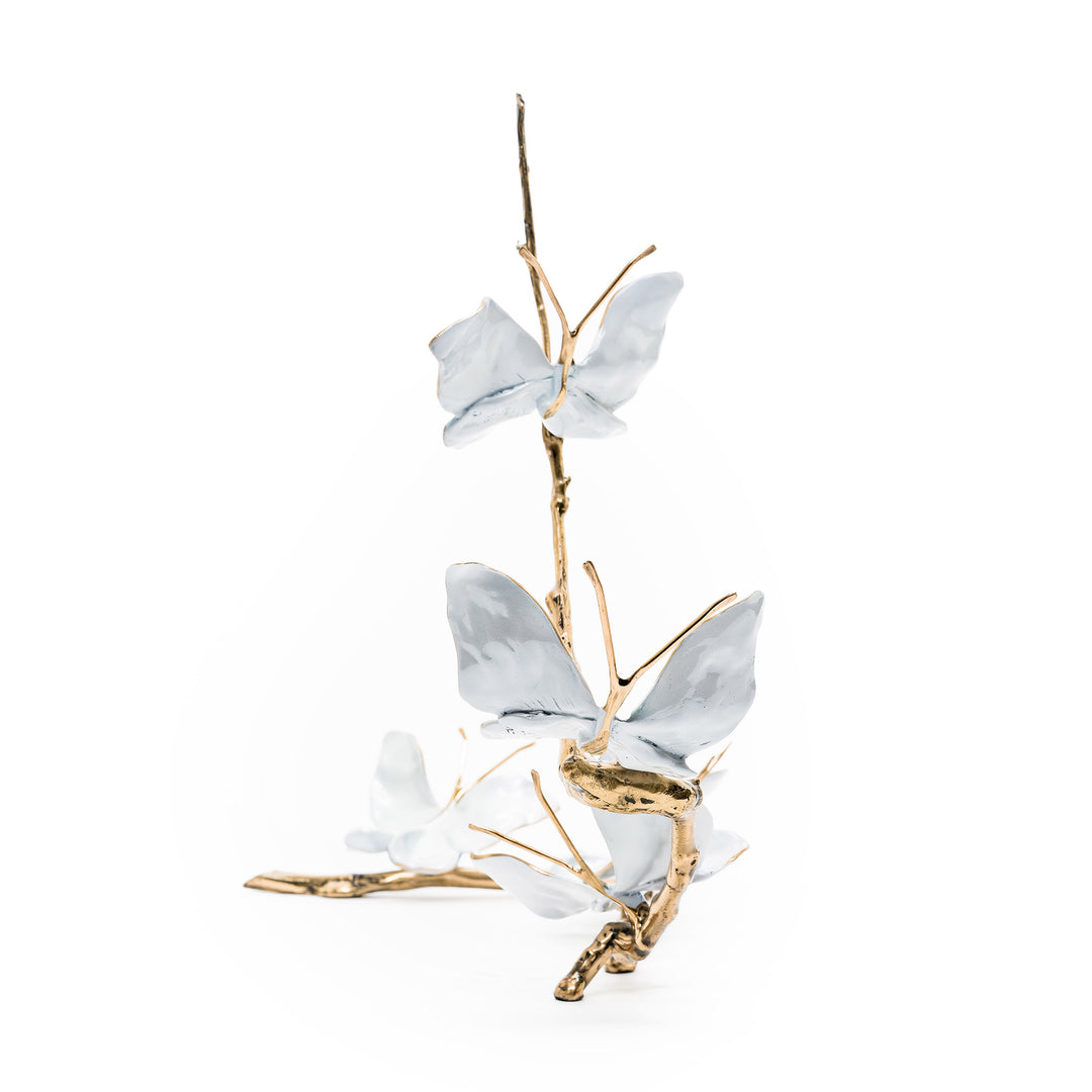 Vertical view of butterflies ascending bronze branch
