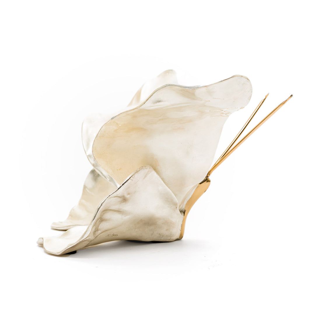Side view of Ruiz white gold butterfly with golden antennae