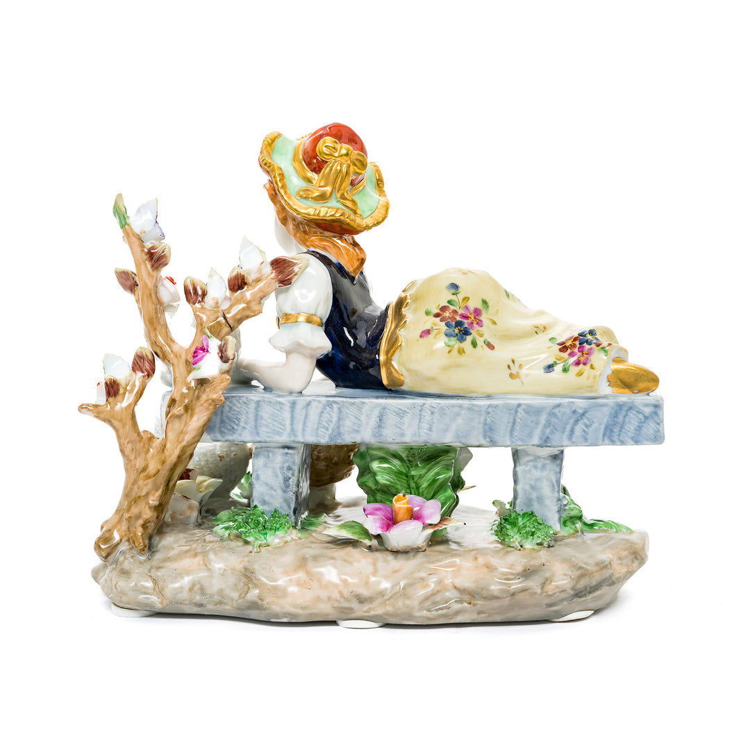 Young girl feeding doves in a serene nature scene, crafted from German porcelain with intricate details.