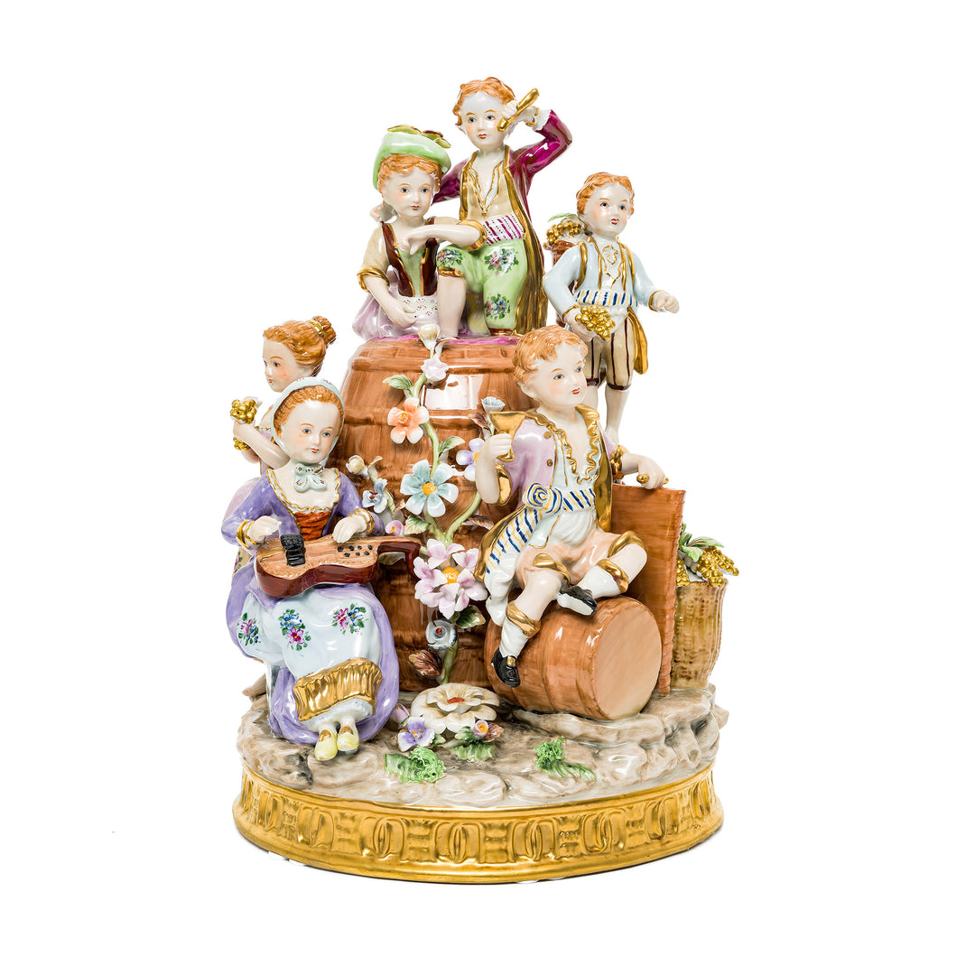 Young Winemakers Family German porcelain figurine featuring children at play with vibrant details.