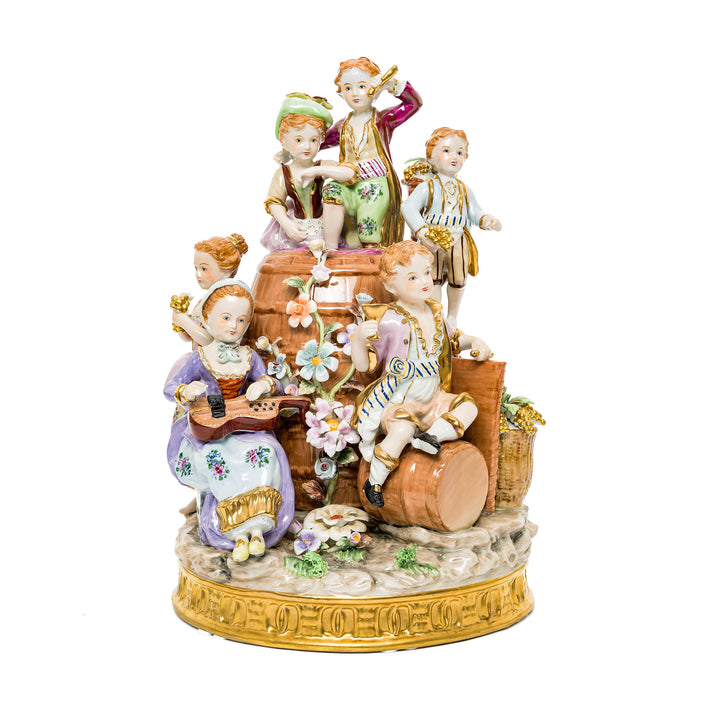 Young Winemakers Family German porcelain figurine featuring children at play with vibrant details.