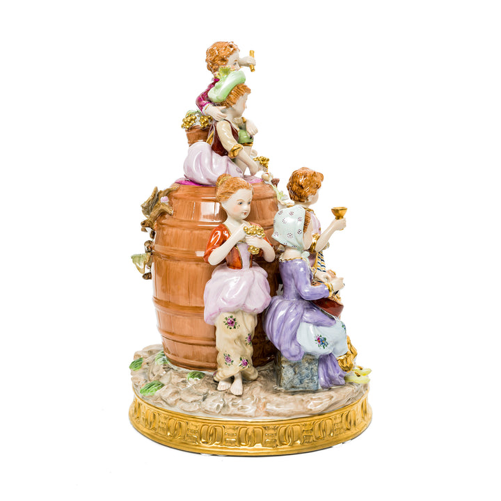 Young winemakers family figurine, hand-painted in bright colors, made from German porcelain.