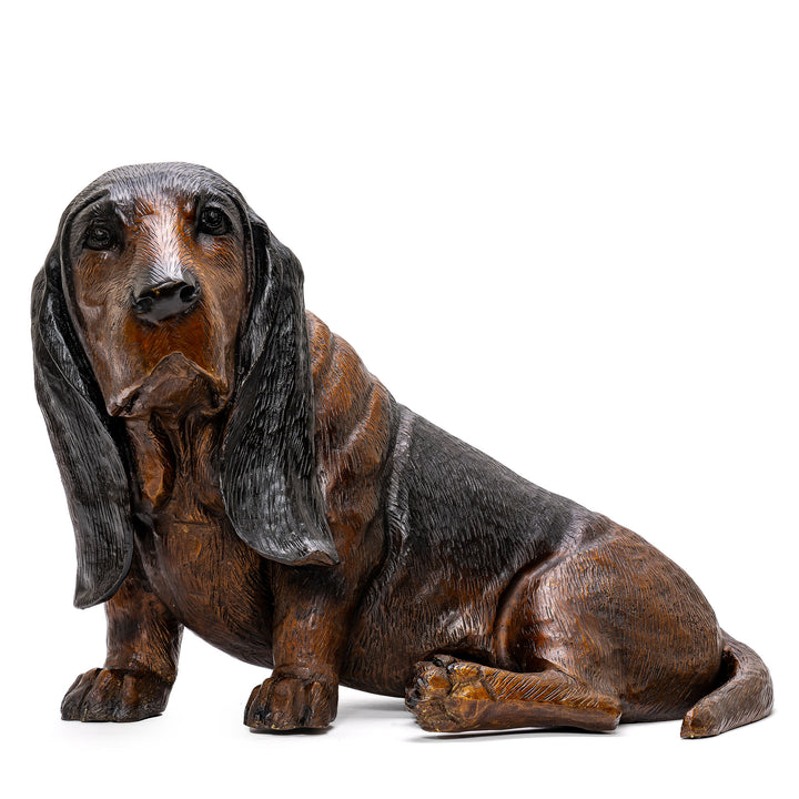 Bronze sculpture of a seated Bassett Hound