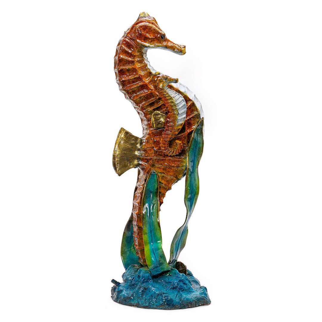 Seahorse sculpture amidst bronze seaweed