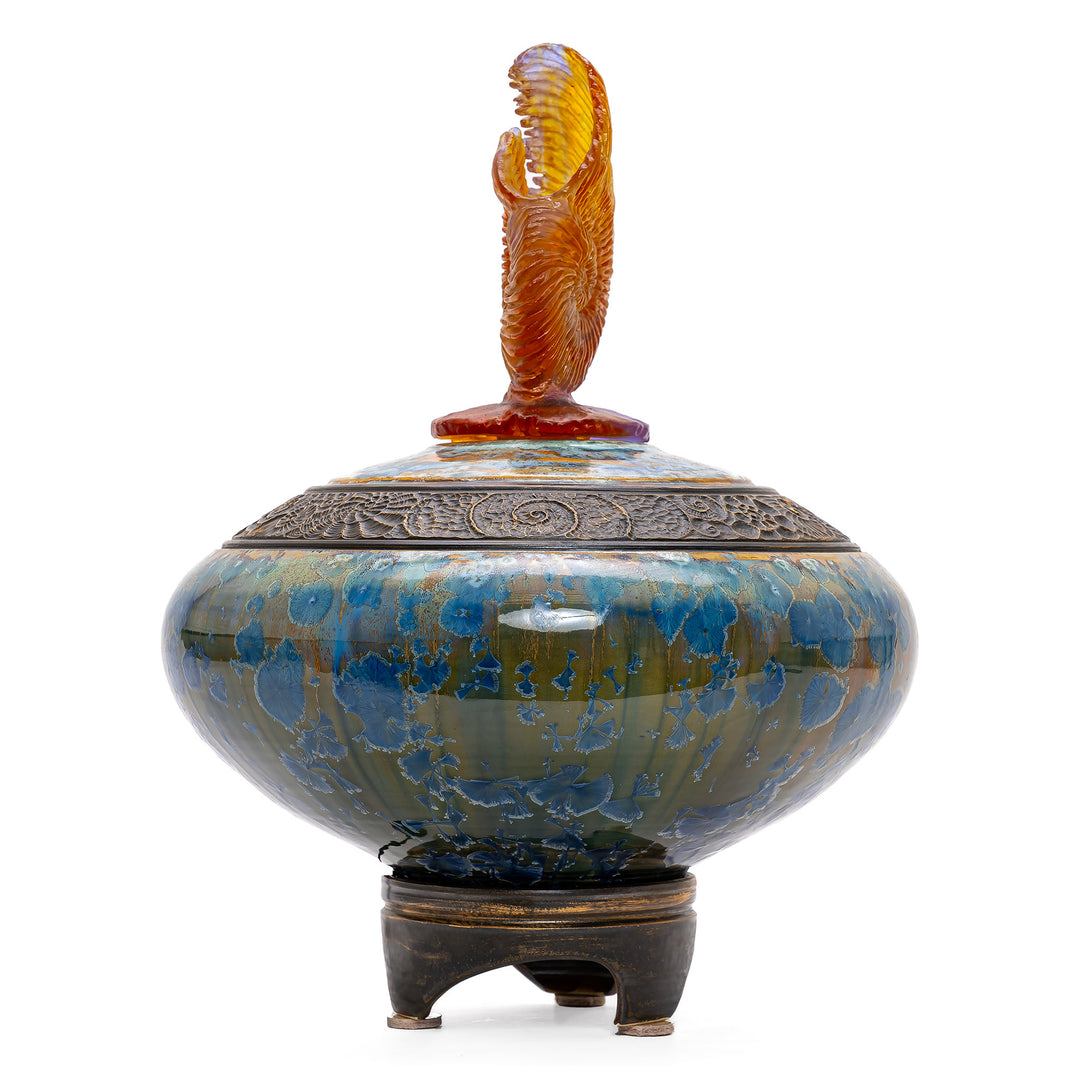 Artistic blue porcelain and bronze vessel with aqua crystal top