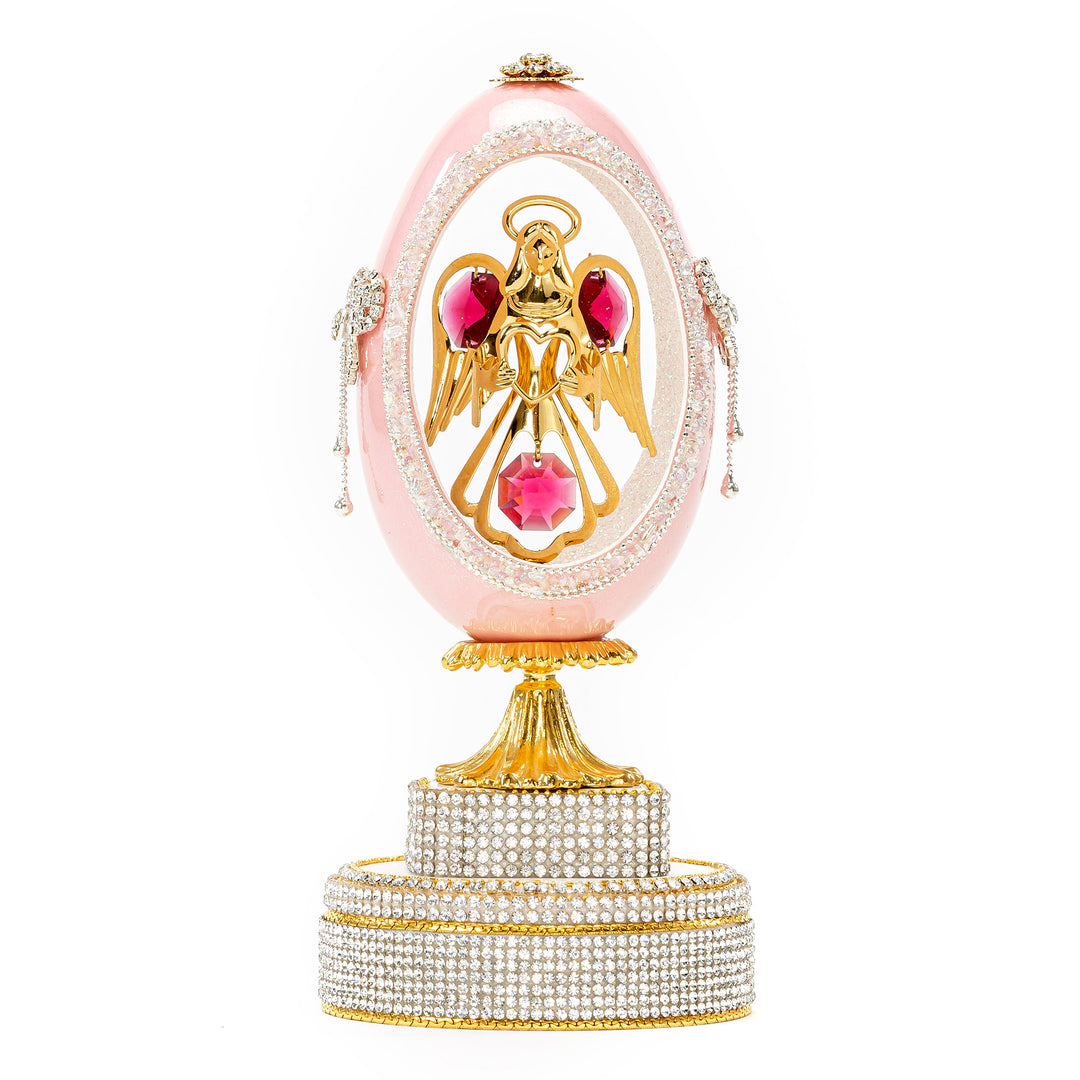 The Egg Fantasy Pink Goose Egg w/Angel Musical part of the  exquisite Egg Fantasy collection is handcrafted in the USA from natural ostrich, emu, goose, duck, and quail eggs. Image #1
