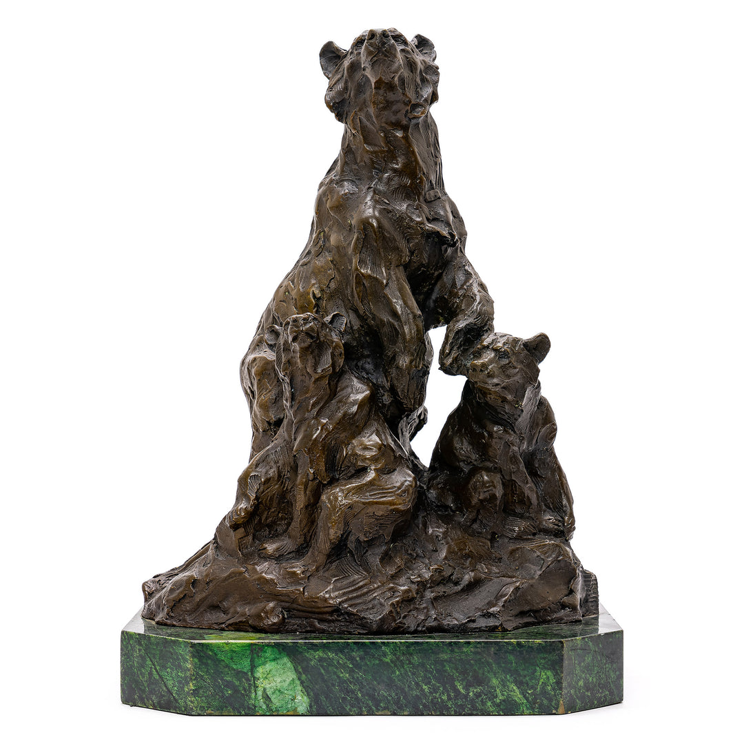 Bronze sculpture of bear family on green marble base