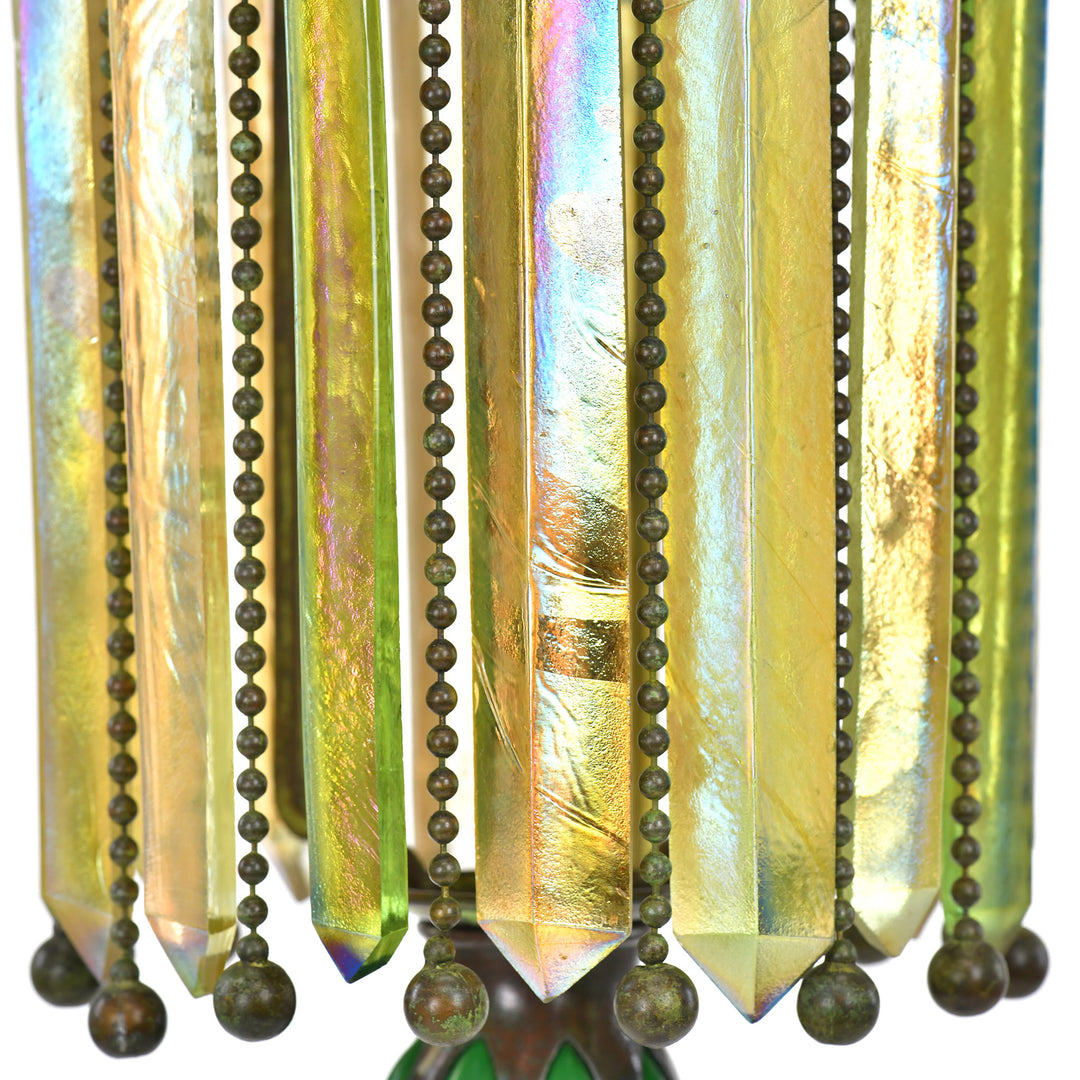 Exquisite 1900 Tiffany candle lamp, featured in 'Tiffany Lamps & Metalware'.