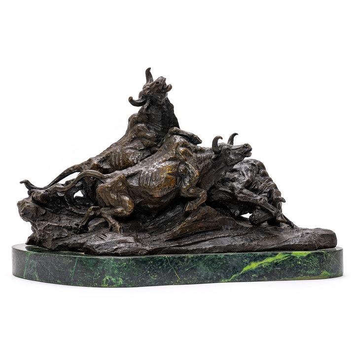 Bronze cattle sculpture on green marble