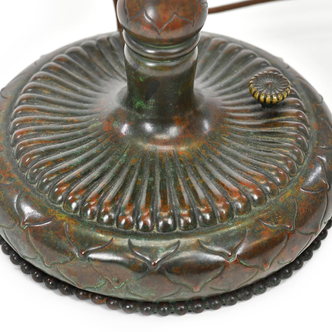 Rich brown patina base with decorative beading detail