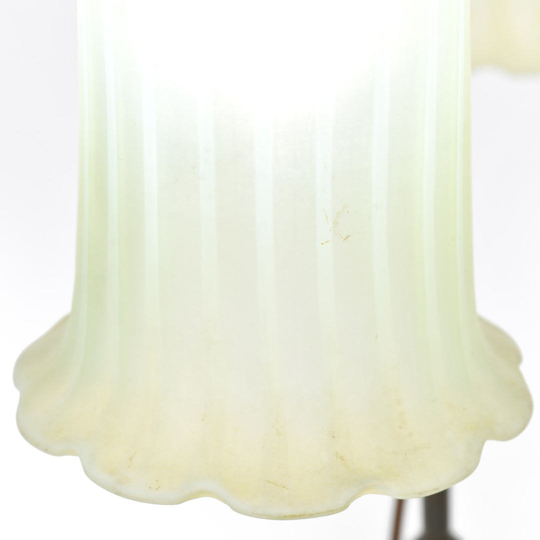 Opalescent bell shaped shades with ruffled rims on lamp