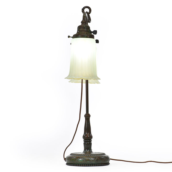 Pair of Tiffany art glass shades on a compact desk lamp